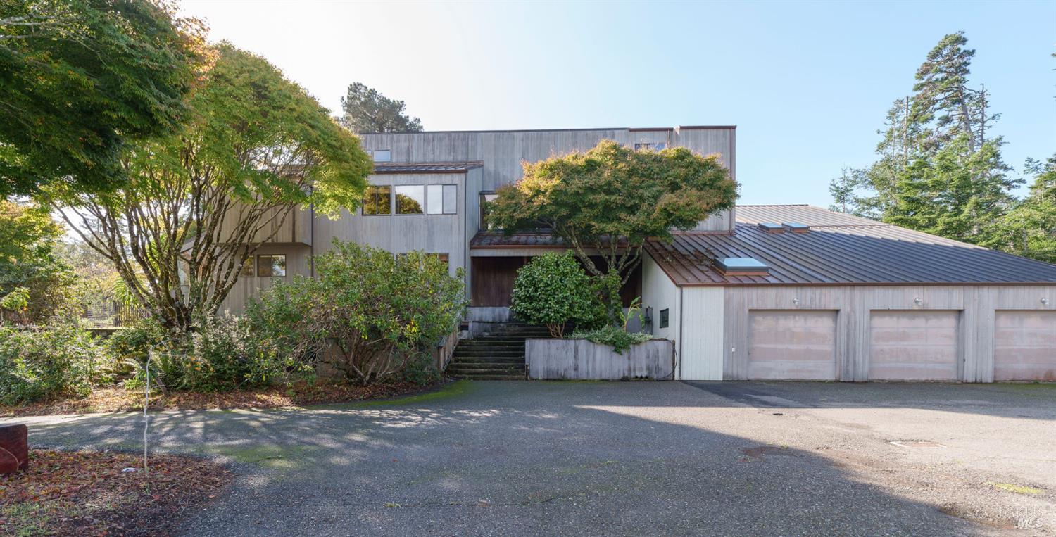36029 Timber Ridge Road The Sea Ranch, CA 95497 - Photo 7 of 59 a house with a tree in front of it