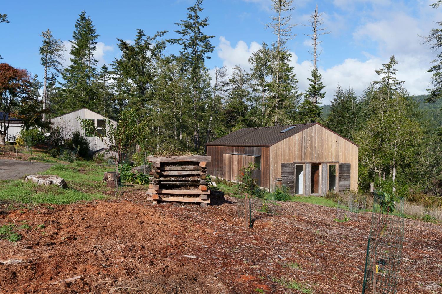 36029 Timber Ridge Road The Sea Ranch, CA 95497 - Photo 10 of 59 a front view of a house with a garden