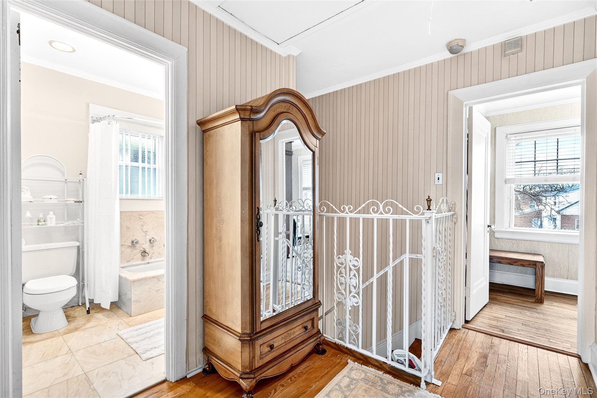 3334 Country Club Road Bronx, NY 10465 - Photo 38 of 49 Corridor with ornamental molding and light wood-type flooring