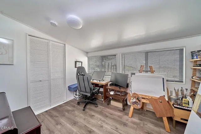 a workspace with furniture and a window