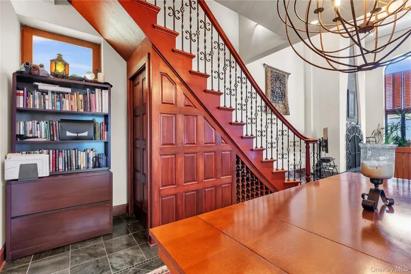 a view of a livingroom with furniture and staircase