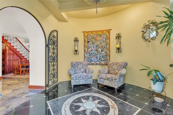 a living room with furniture and a rug