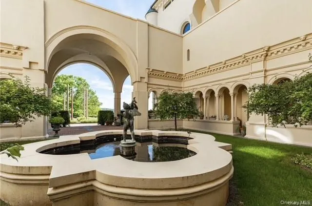 a view of a swimming pool with a yard