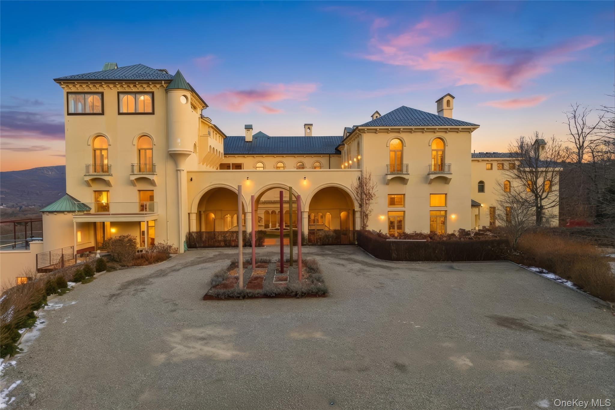 42 Dick's Castle Road Garrison, NY 10524 - Photo 39 of 45 View of front of property with a chimney, stucco siding, and curved driveway