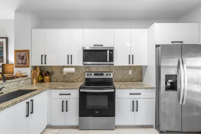 a kitchen with a stove microwave and refrigerator