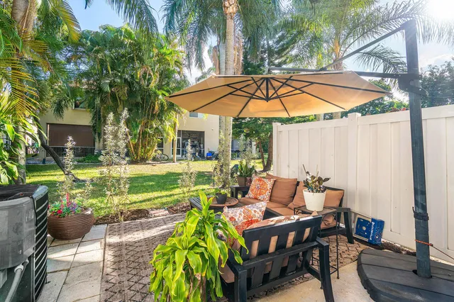 a patio with table and chairs