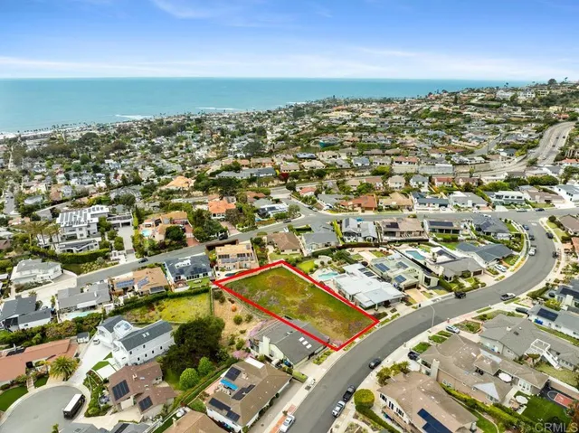 an aerial view of residential building with parking space