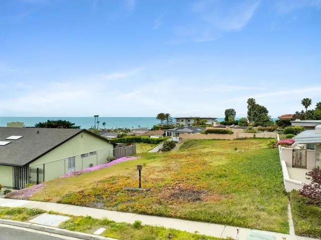 a view of a swimming pool with an ocean view