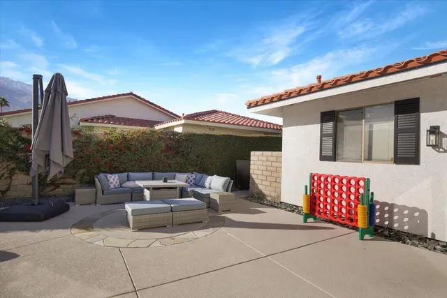 a front view of a house with sitting area