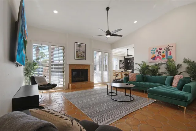 a living room with furniture and a fireplace