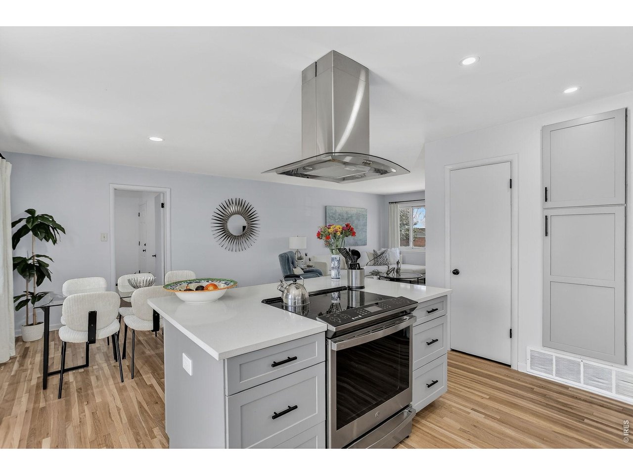 265 South 39th Street Boulder, CO 80305 - Photo 12 of 34 a kitchen with stainless steel appliances a stove a chimney a sink and cabinets