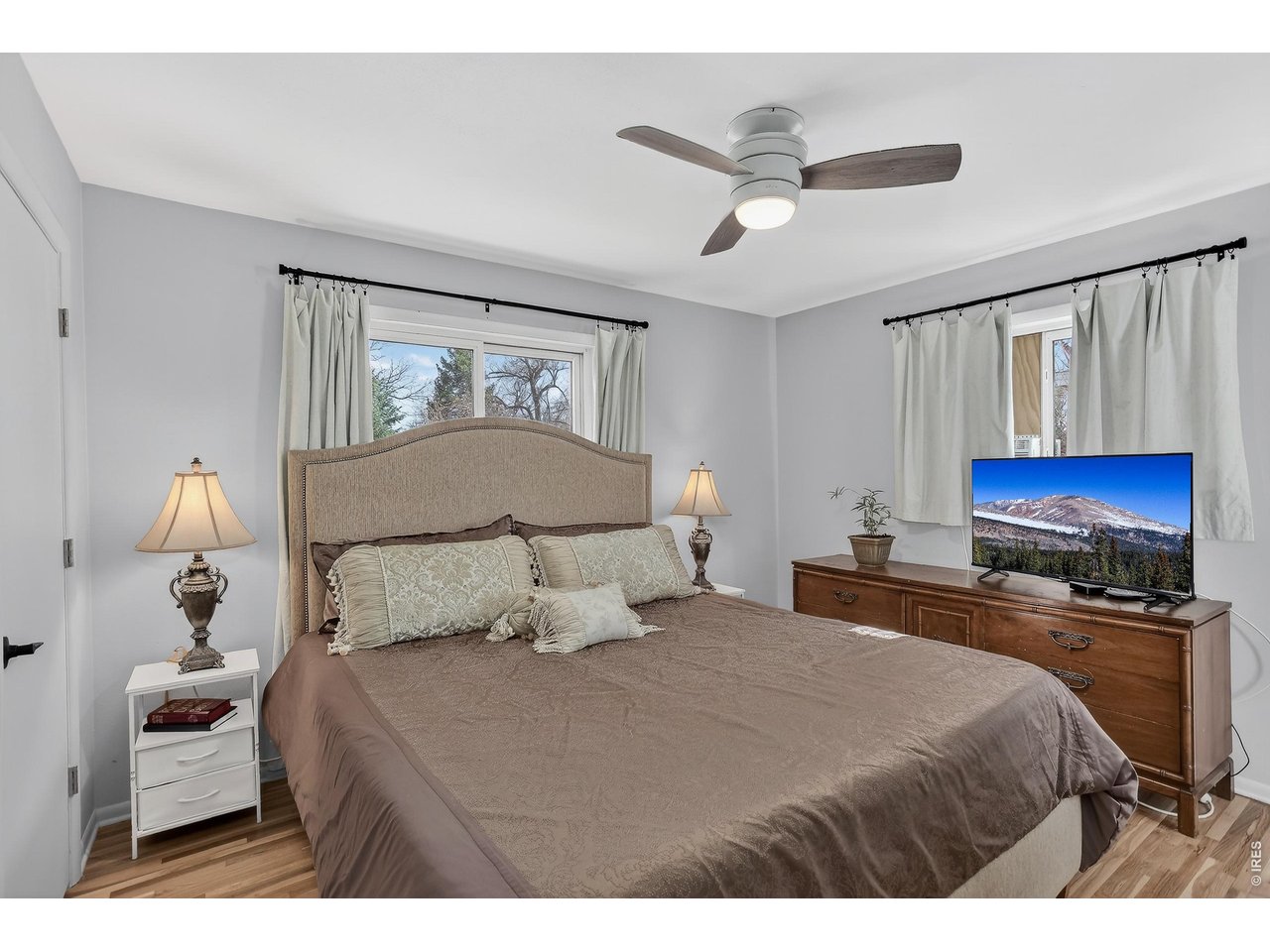 265 South 39th Street Boulder, CO 80305 - Photo 14 of 34 a bedroom with a bed and a flat screen tv