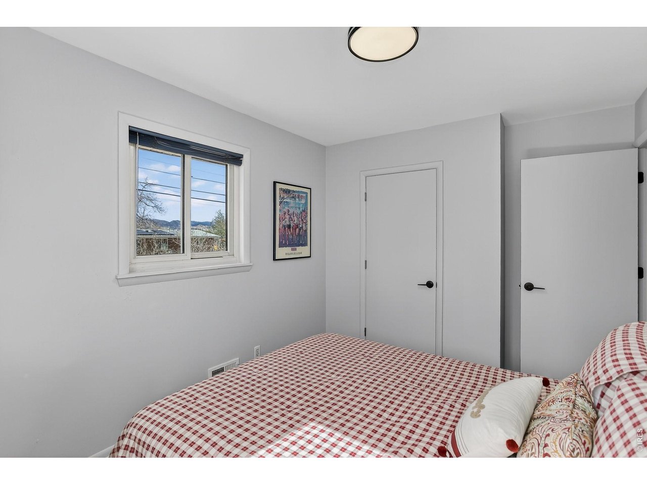 265 South 39th Street Boulder, CO 80305 - Photo 19 of 34 a bedroom with a bed and a window