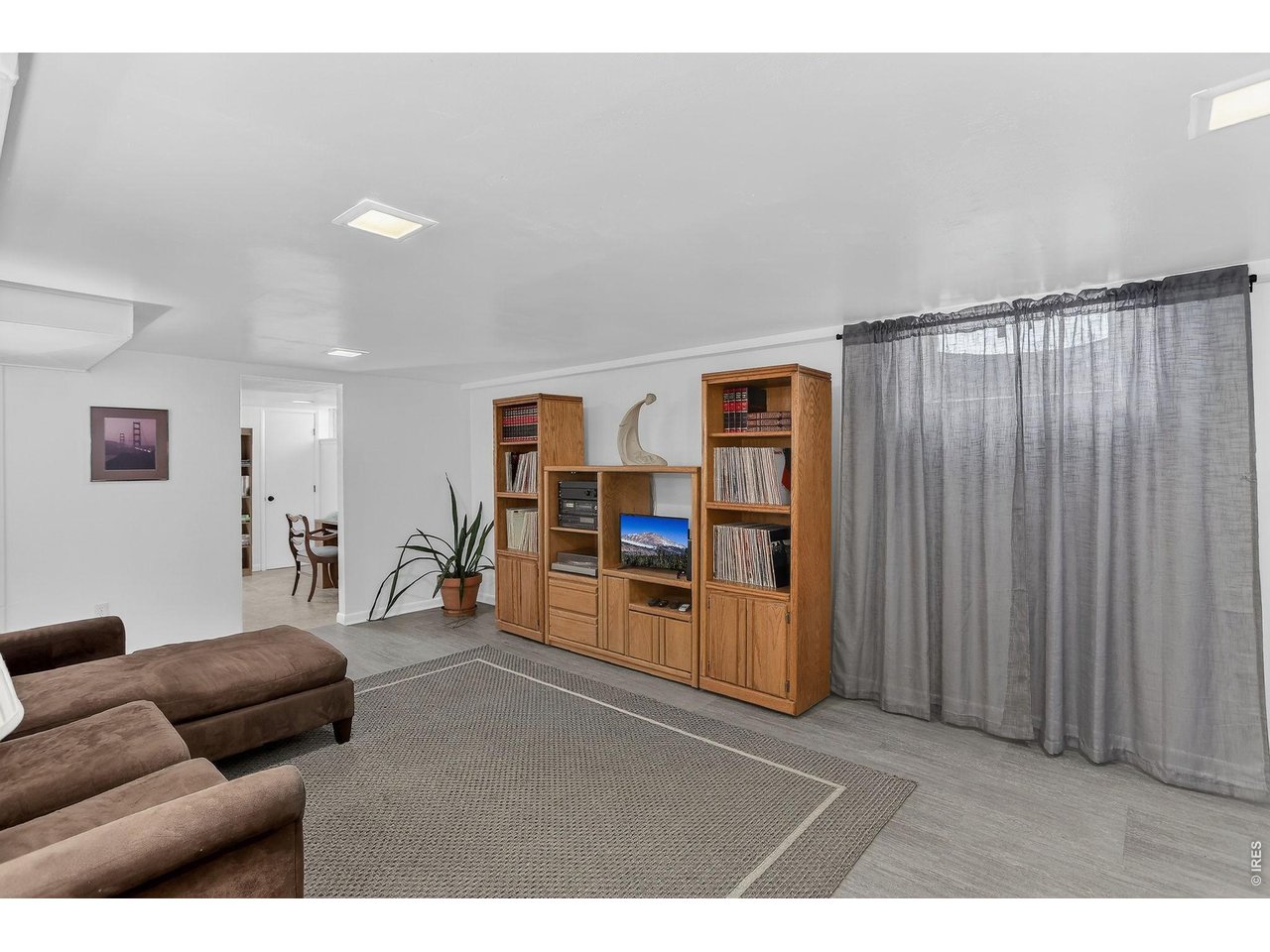 265 South 39th Street Boulder, CO 80305 - Photo 26 of 34 a living room with furniture and wooden floor