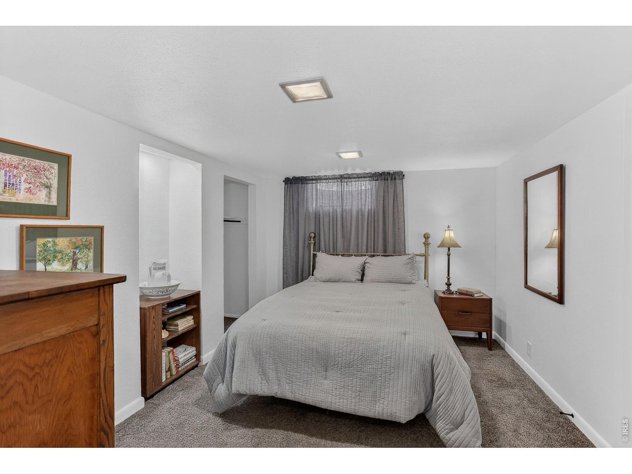 265 South 39th Street Boulder, CO 80305 - Photo 28 of 34 a bedroom with a bed and a flat screen tv