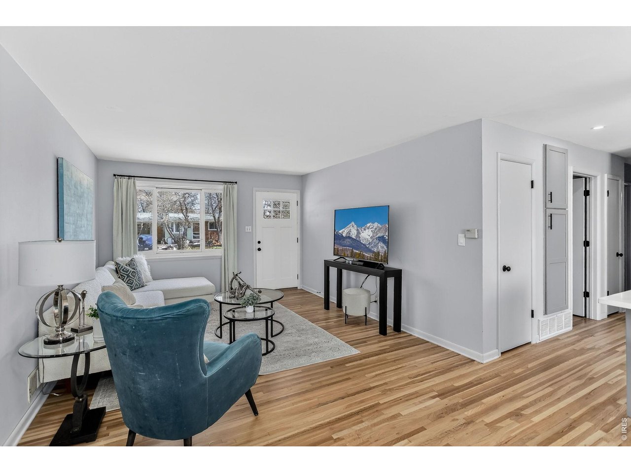 265 South 39th Street Boulder, CO 80305 - Photo 6 of 34 a living room with furniture a wooden floor and a large window