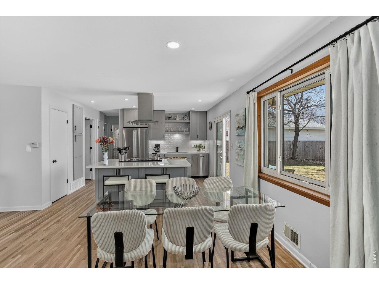 265 South 39th Street Boulder, CO 80305 - Photo 9 of 34 a dining hall with stainless steel appliances kitchen island granite countertop furniture and a large window