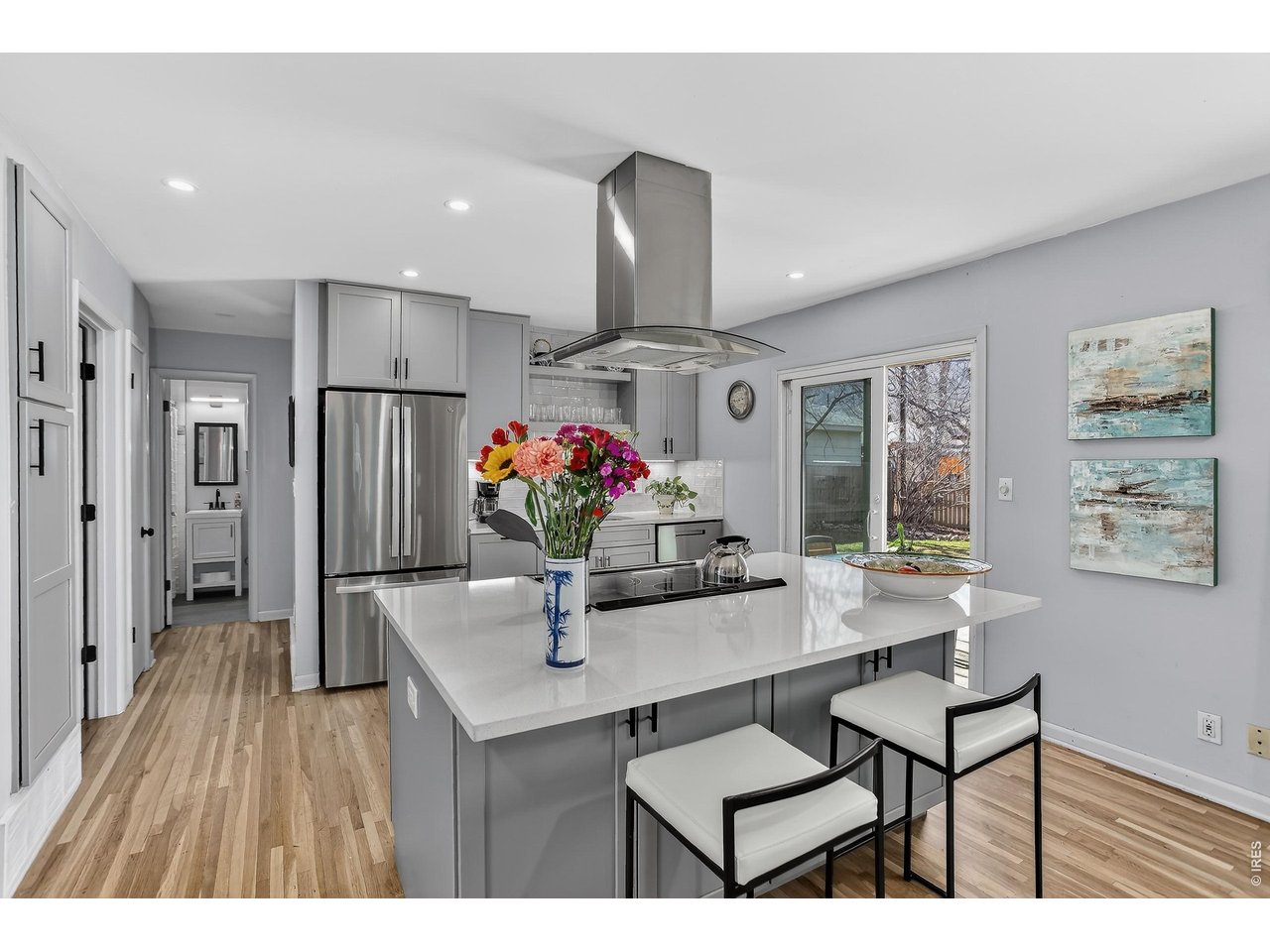 265 South 39th Street Boulder, CO 80305 - Photo 10 of 34 a view of kitchen island dining table and wooden floor