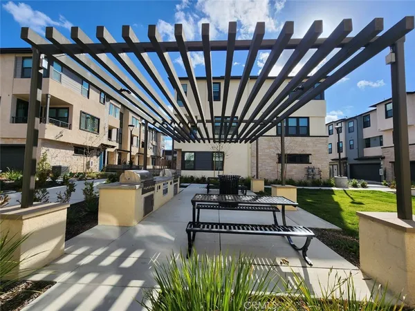 a living room with furniture a rug and a fireplace