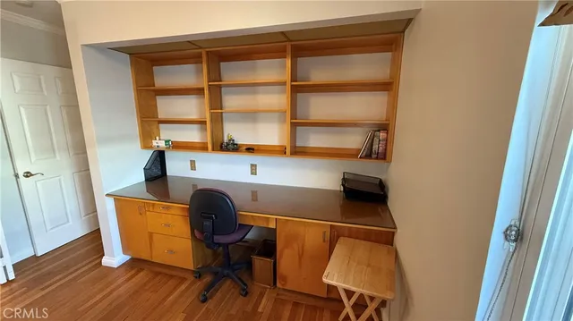 a workspace with furniture and a window