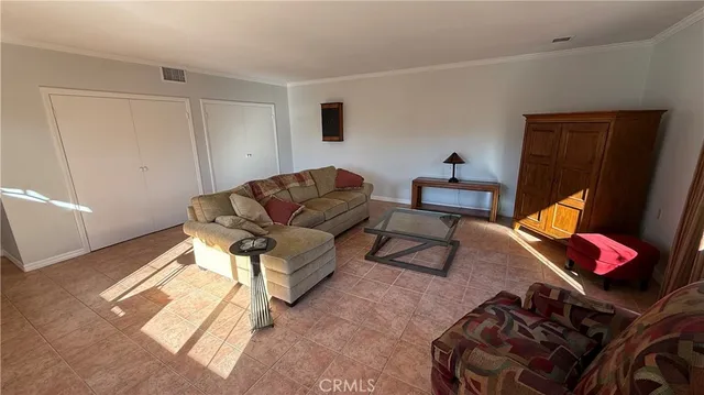 a bedroom with furniture and a bed