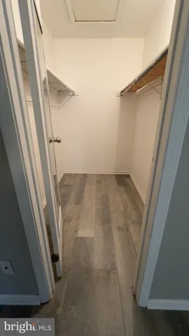 an empty room with a empty space and windows