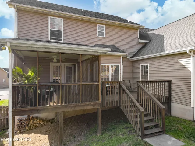 a view of a house with a small yard and a large window