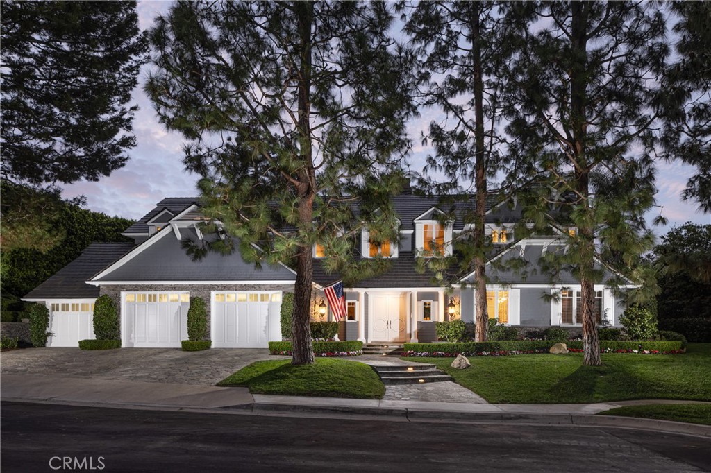 56 Royal St George Road Newport Beach, CA 92660 - Photo 1 of 49 a front view of a house with a yard