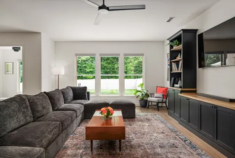 a living room with furniture and a window