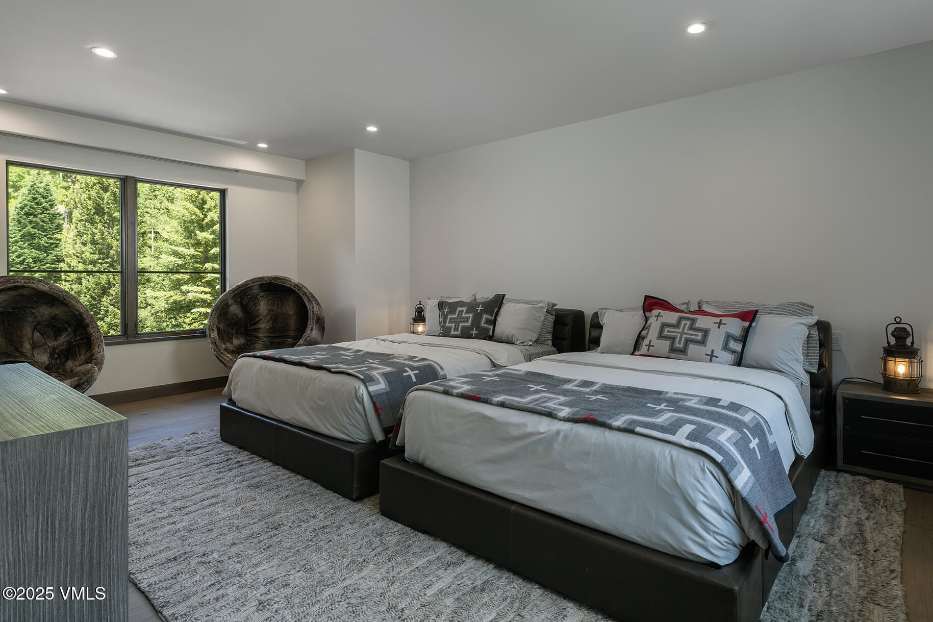 187 Elk Track Road Beaver Creek, CO 81620 - Photo 17 of 19 a bedroom with two beds and a large window