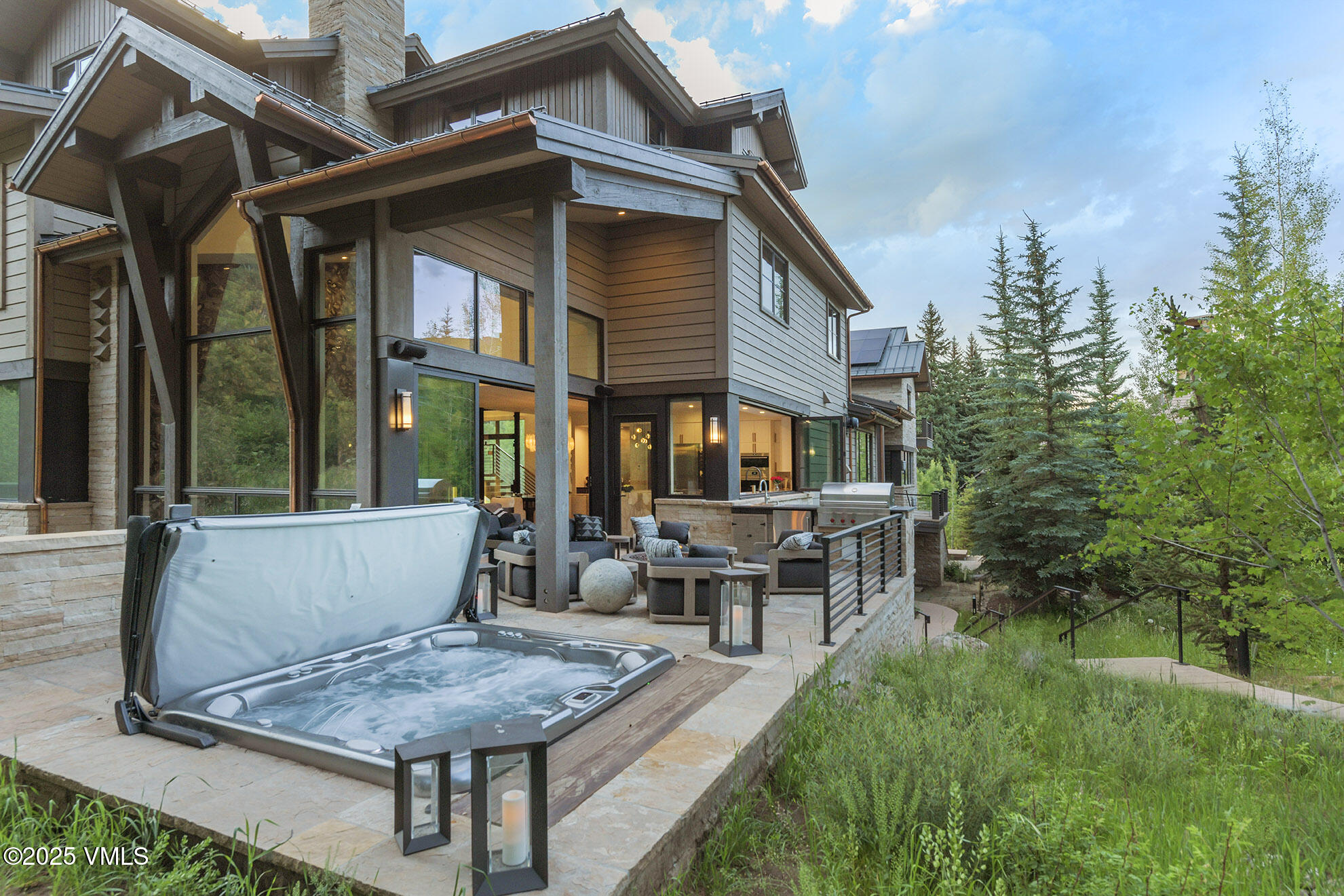 187 Elk Track Road Beaver Creek, CO 81620 - Photo 2 of 19 a view of house with a yard and sitting area