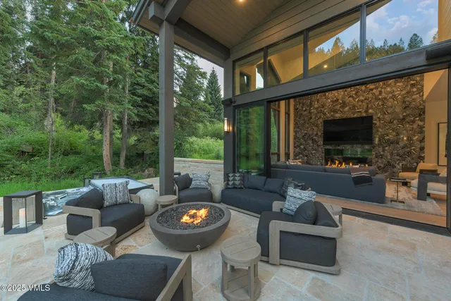 a view of an outdoor dining space with a table and chairs