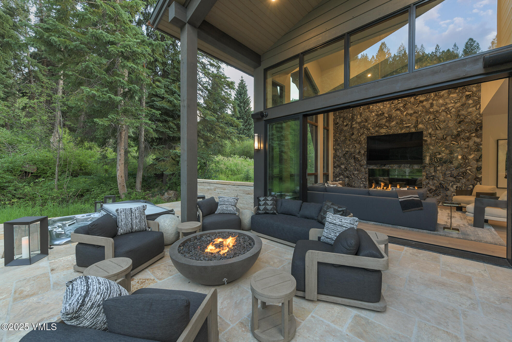 187 Elk Track Road Beaver Creek, CO 81620 - Photo 5 of 19 a view of an outdoor dining space with a table and chairs