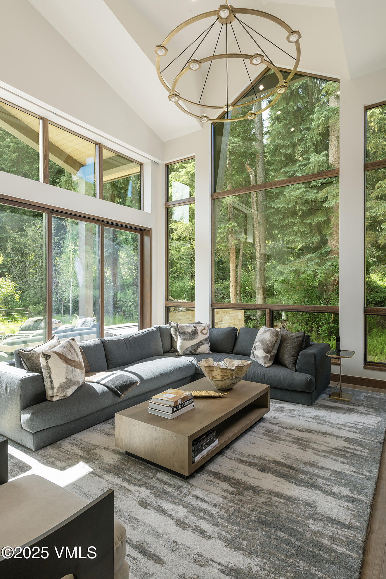 187 Elk Track Road Beaver Creek, CO 81620 - Photo 8 of 19 a living room with furniture and a large window