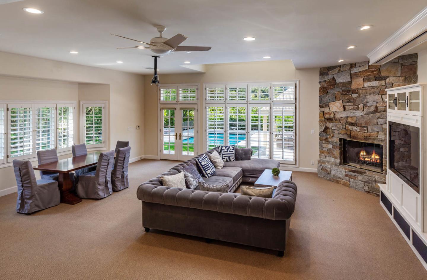 340 Jane Drive Woodside, CA 94062 - Photo 16 of 48 a living room with furniture and a fireplace