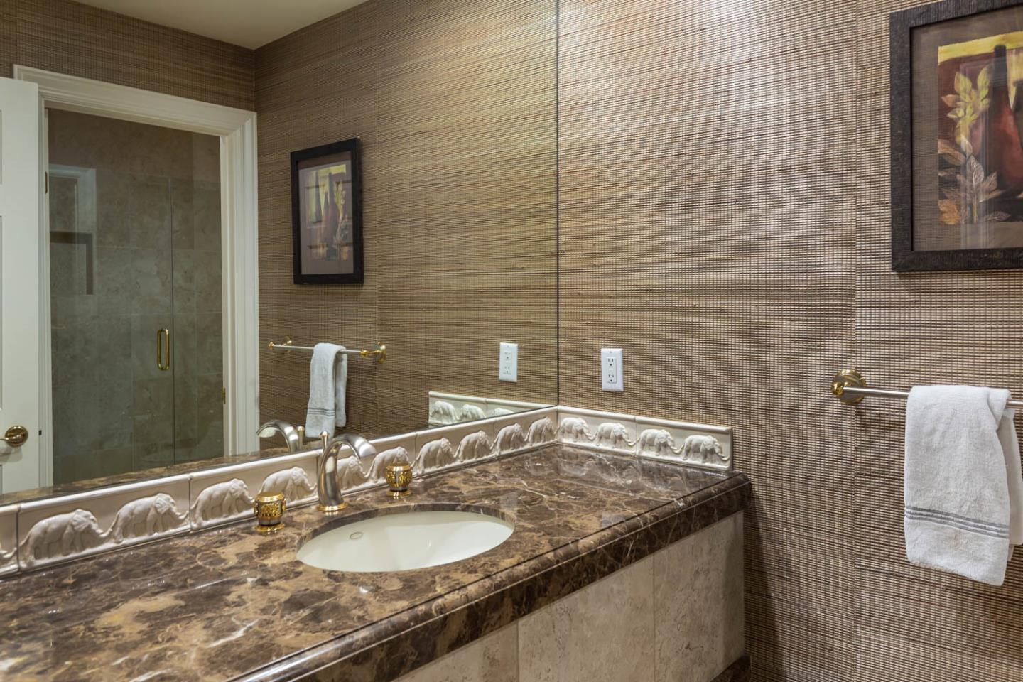 340 Jane Drive Woodside, CA 94062 - Photo 19 of 48 a bathroom with a granite countertop sink and a mirror