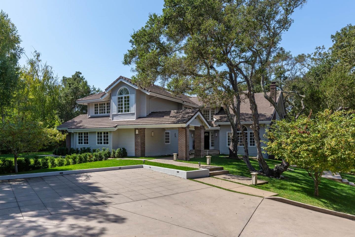 340 Jane Drive Woodside, CA 94062 - Photo 2 of 48 a front view of a house with a garden