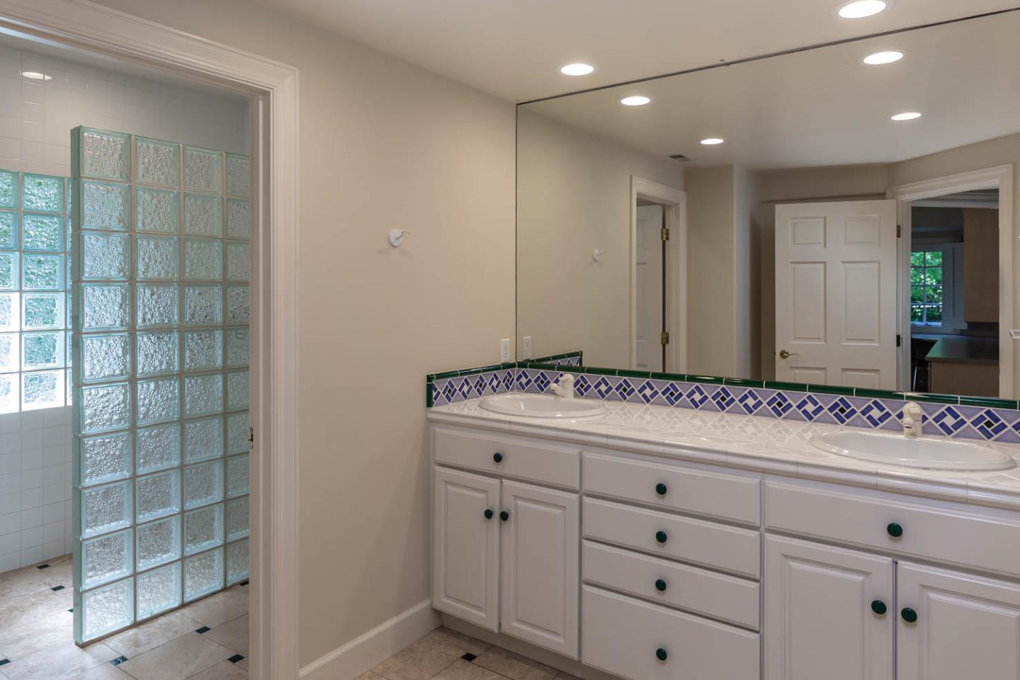 340 Jane Drive Woodside, CA 94062 - Photo 33 of 48 a bathroom with a sink and a mirror