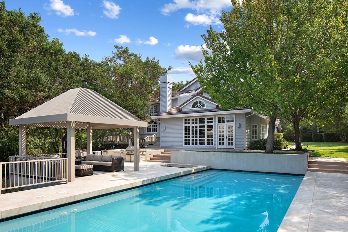 340 Jane Drive Woodside, CA 94062 - Photo 7 of 48 a view of a house with backyard and sitting area