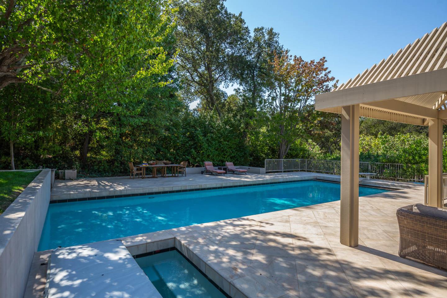 340 Jane Drive Woodside, CA 94062 - Photo 9 of 48 a view of a swimming pool with a patio