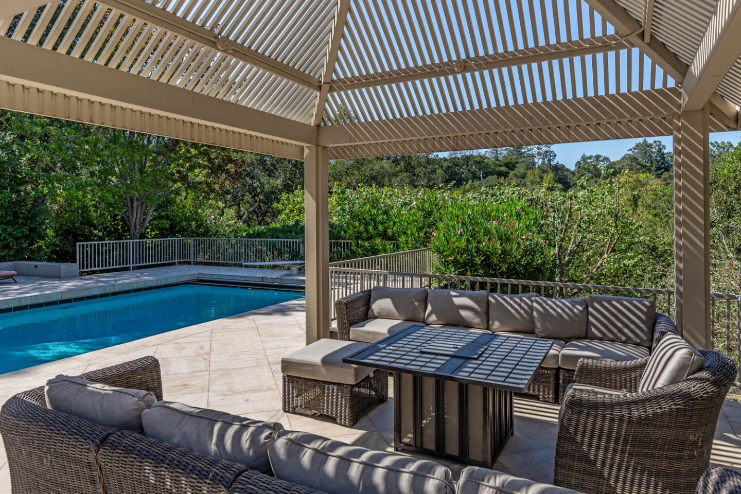 340 Jane Drive Woodside, CA 94062 - Photo 10 of 48 a view of a patio with a table chairs and a backyard