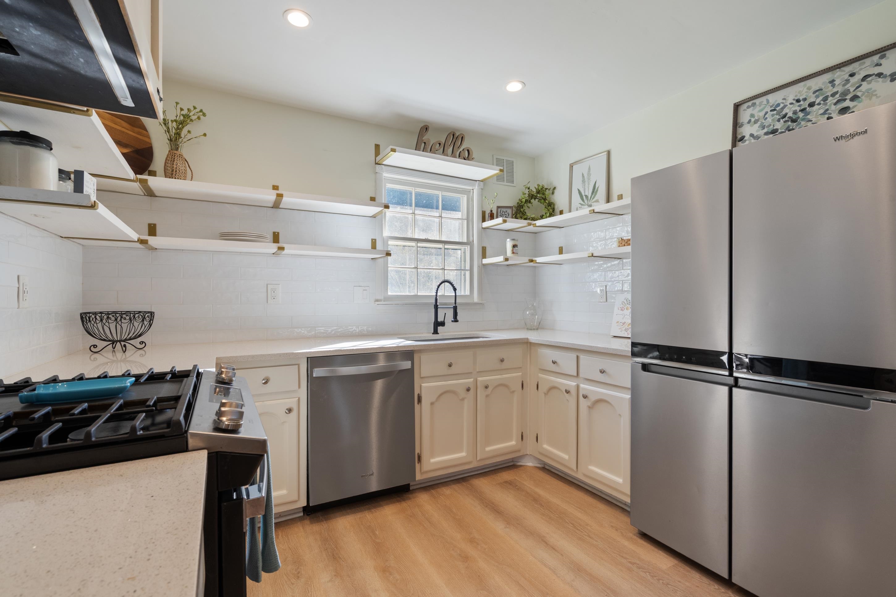 301 Dove Valley Road Collierville, TN 38017 - Photo 11 of 32 a kitchen with a sink appliances and cabinets