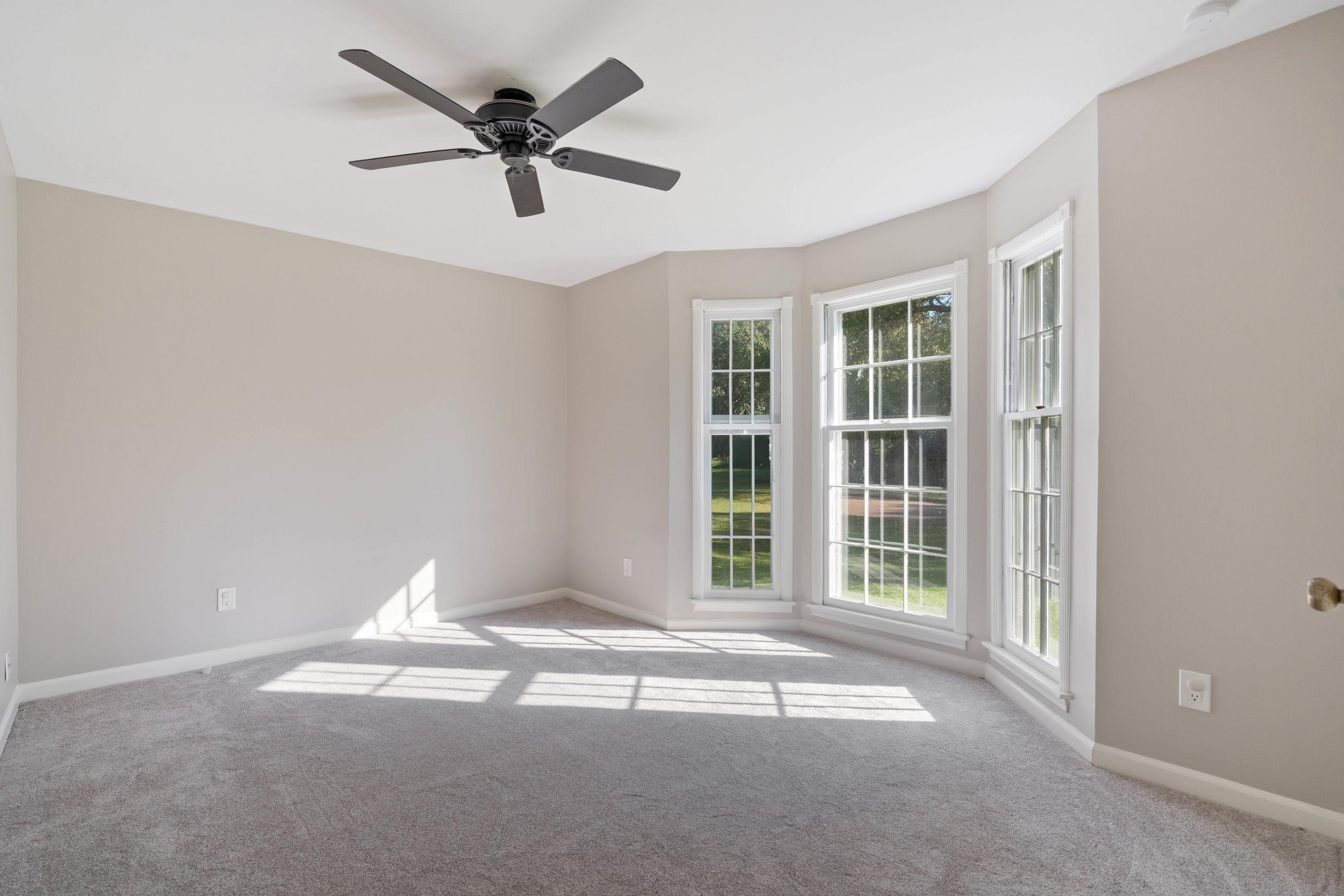 301 Dove Valley Road Collierville, TN 38017 - Photo 14 of 32 a view of a livingroom with a ceiling fan and window