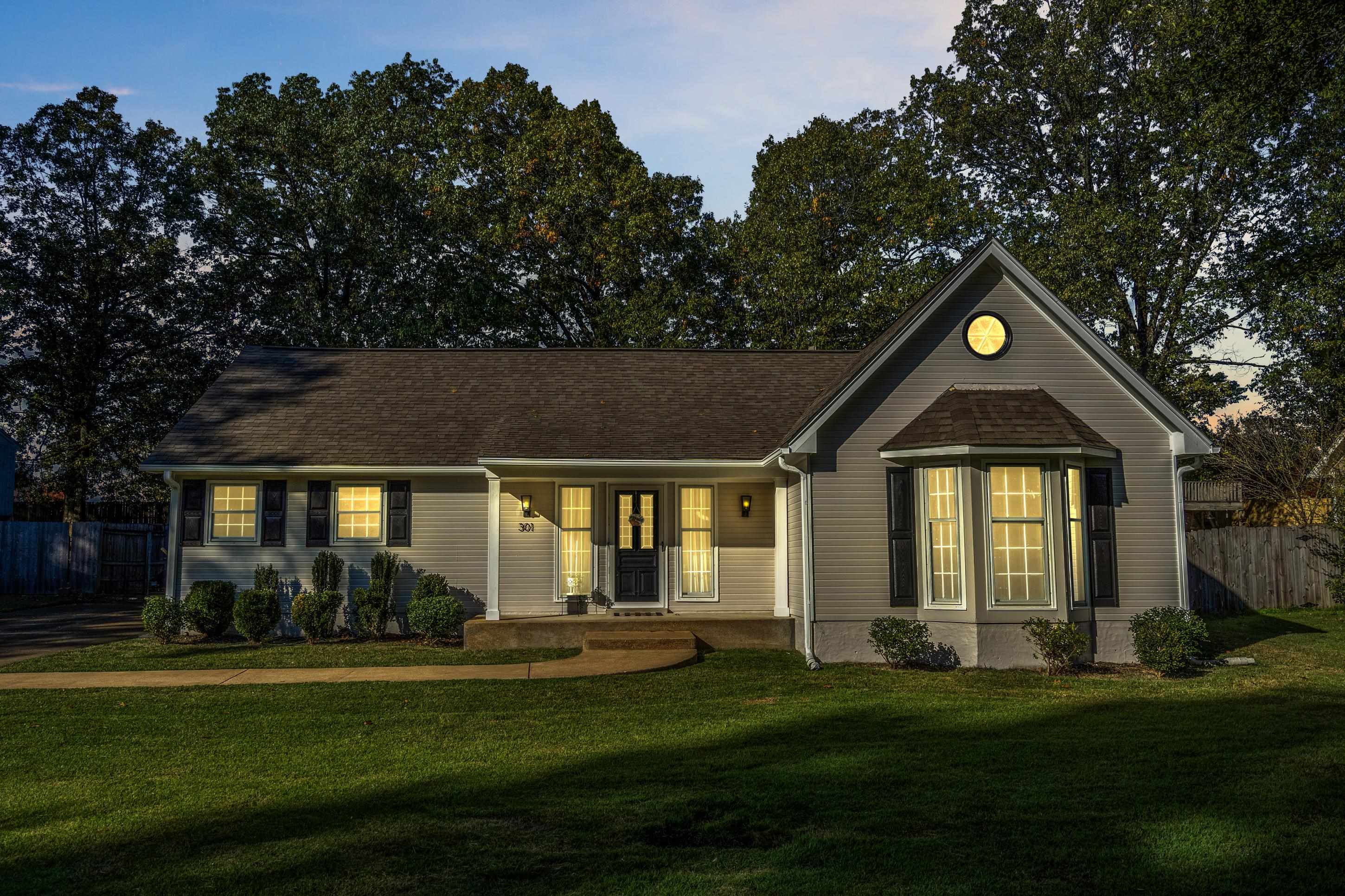 301 Dove Valley Road Collierville, TN 38017 - Photo 2 of 32 a front view of a house with a yard