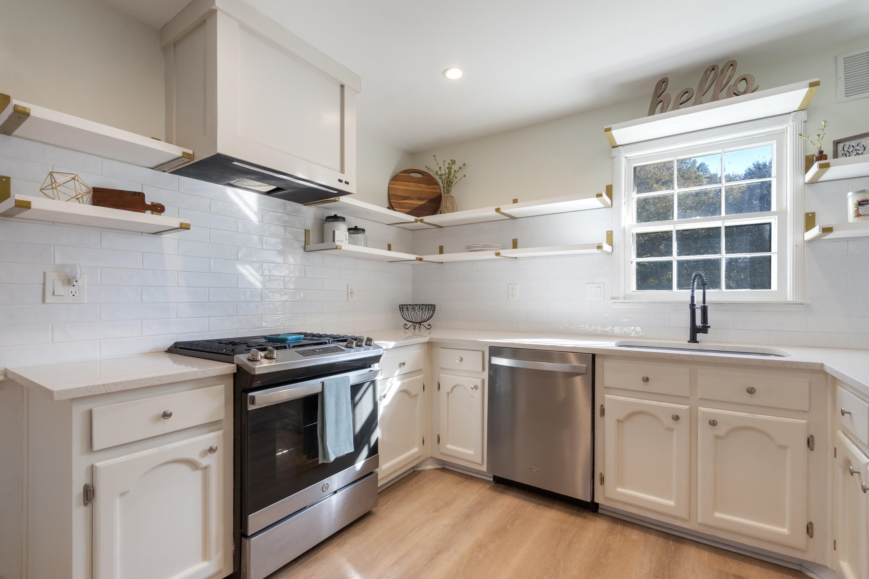 301 Dove Valley Road Collierville, TN 38017 - Photo 10 of 32 a kitchen with stainless steel appliances granite countertop a sink a stove and cabinets