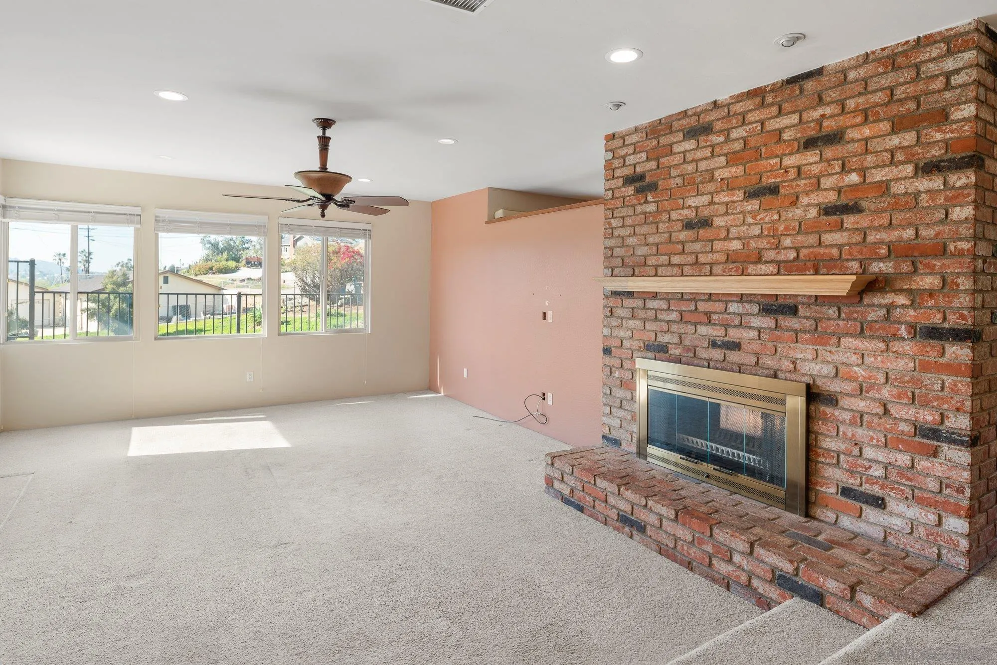 1999 Valley Rim Road El Cajon, CA 92019 - Photo 8 of 41 an empty room with windows and fireplace