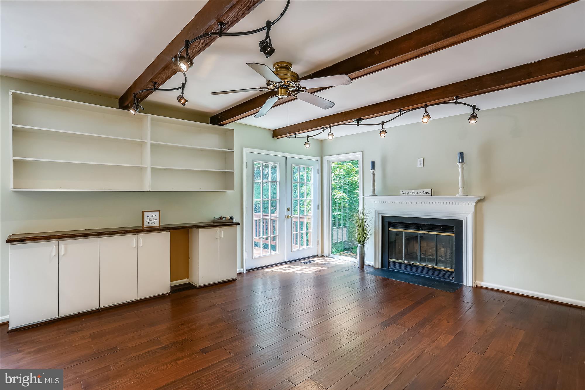 8908 Spring Berry Court Gaithersburg, MD 20886 - Photo 14 of 59 Family Room with fireplace and French door to deck