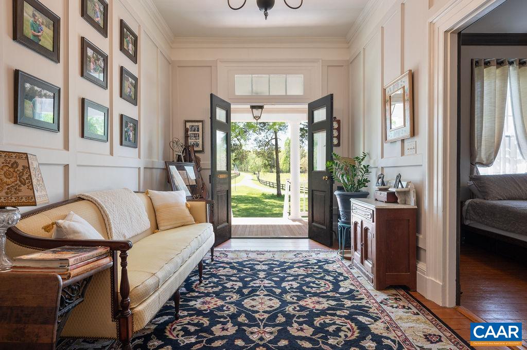 631 Old Rectory Lane Fork Union, VA 23055 - Photo 11 of 65 a living room with furniture and a floor to ceiling window