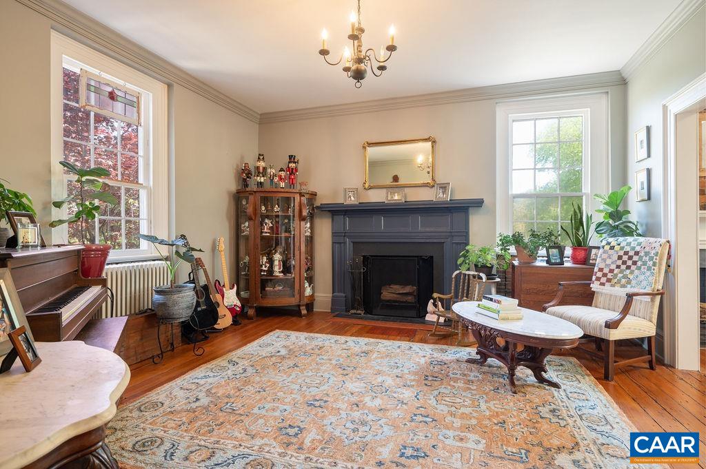 631 Old Rectory Lane Fork Union, VA 23055 - Photo 12 of 65 a living room with furniture a rug and a fireplace