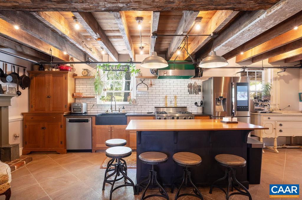 631 Old Rectory Lane Fork Union, VA 23055 - Photo 19 of 65 a kitchen with stainless steel appliances granite countertop a sink and wooden cabinets
